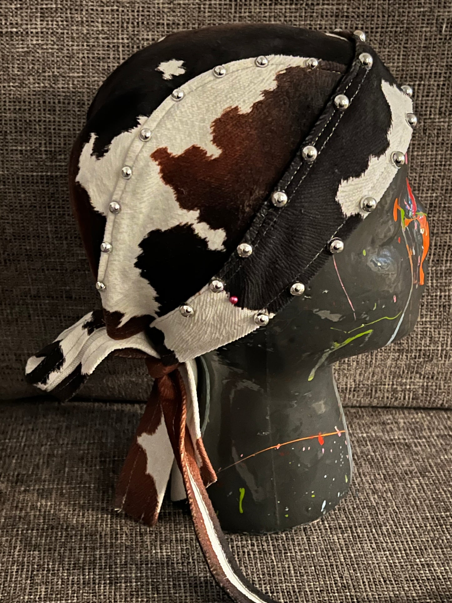 Faux cow hide studded biker cap