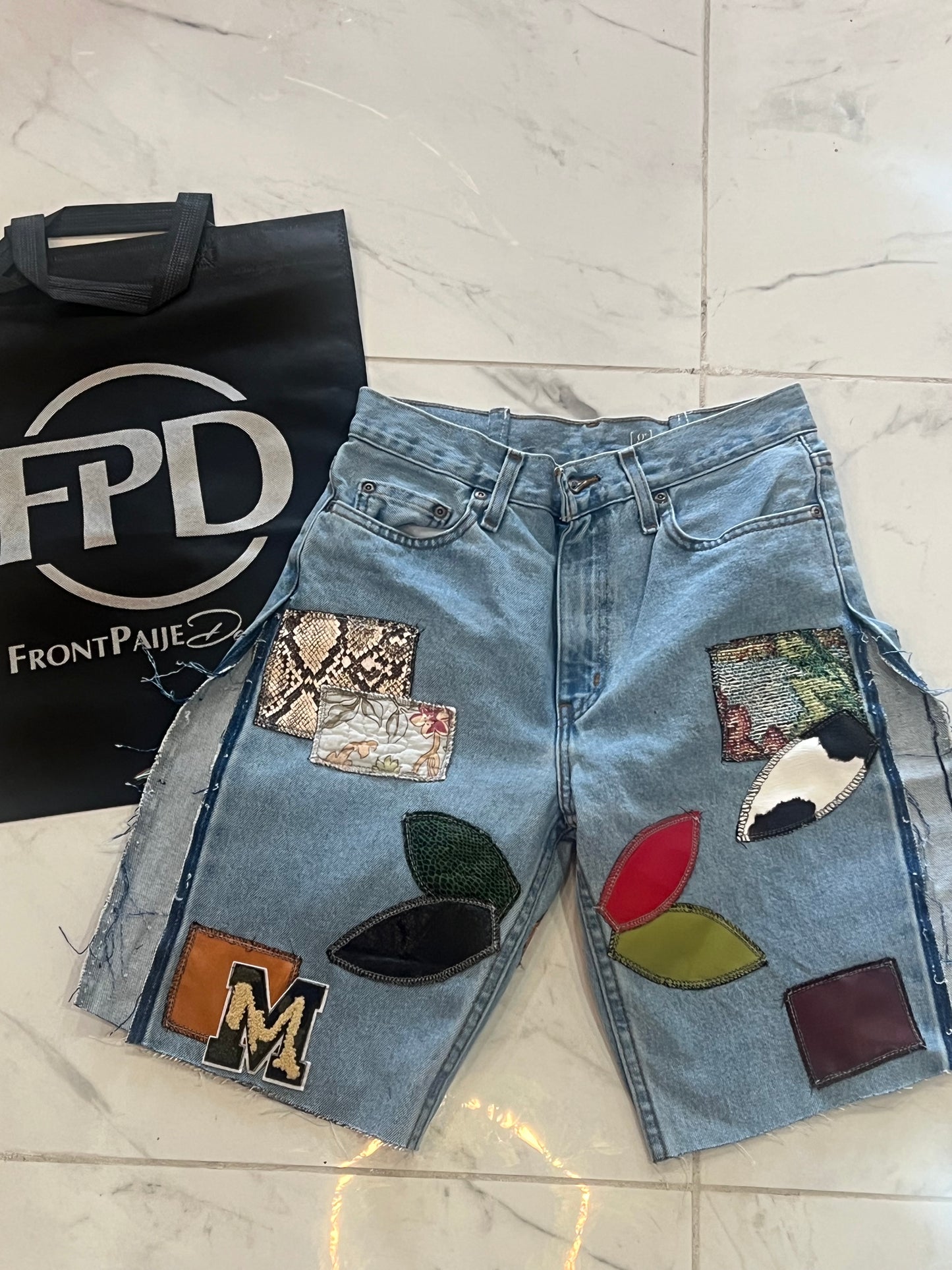 Patchwork light blue denim shorts