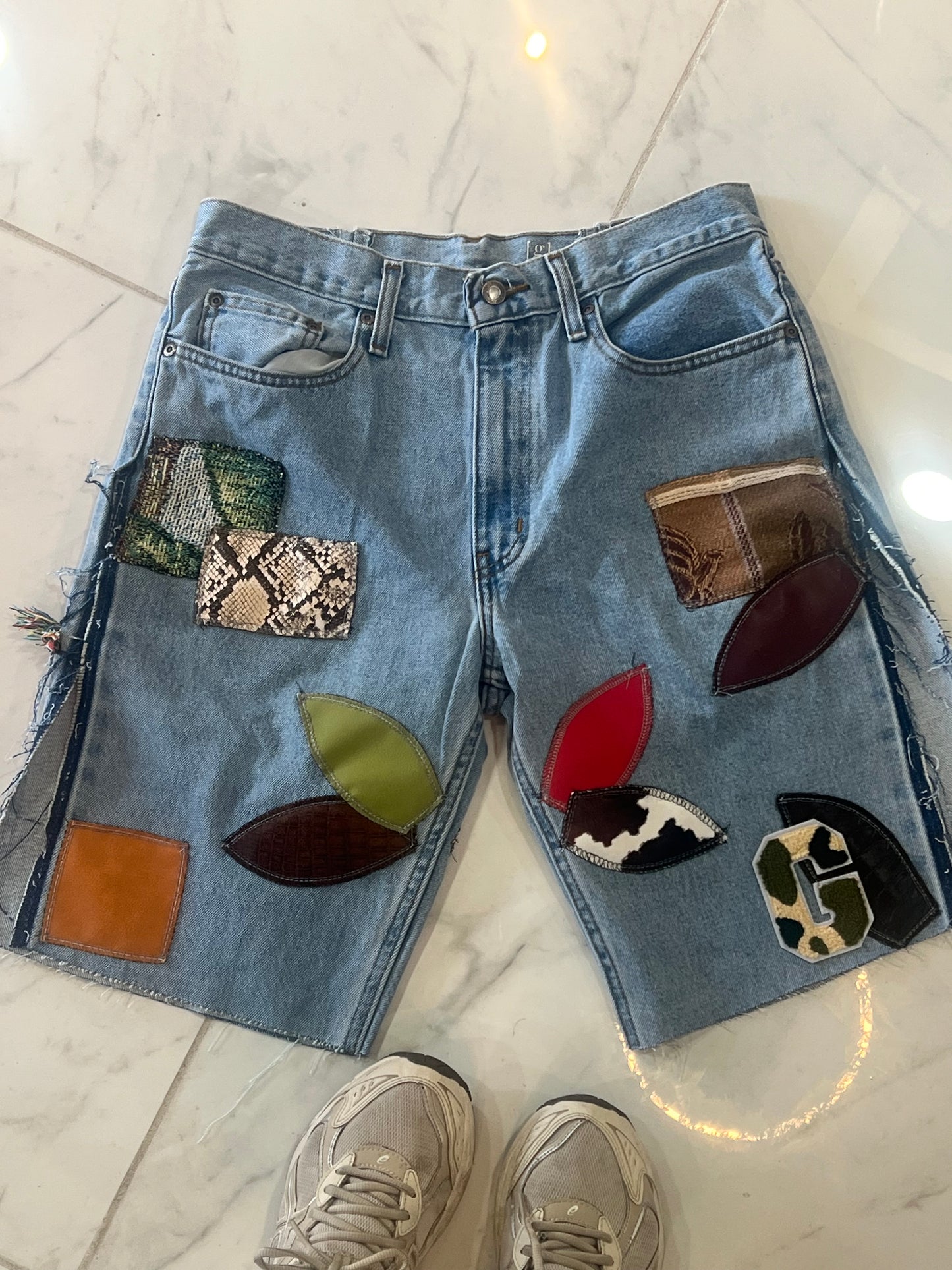 Patchwork light blue denim shorts