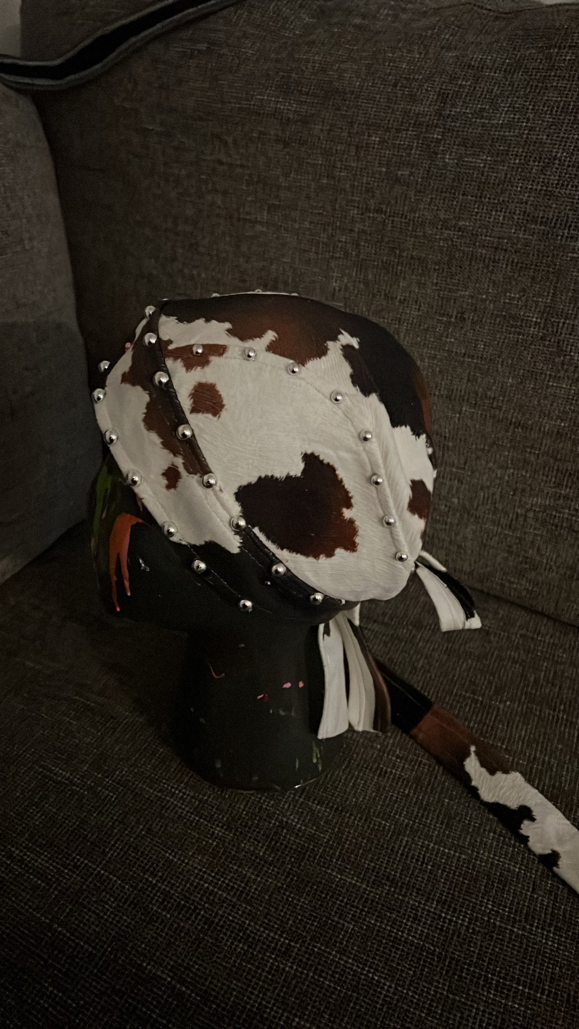 Faux cow hide studded biker cap